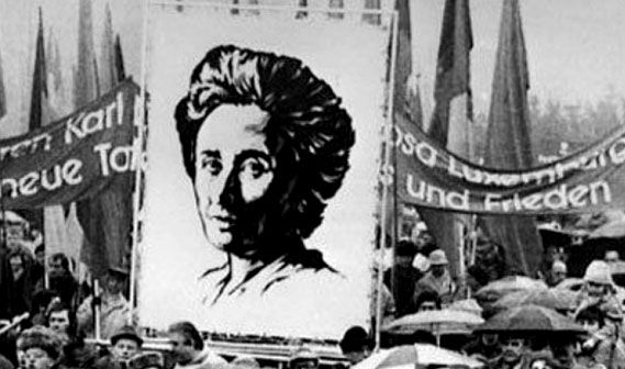 Banner carrying a portret of Rosa Luxemburg