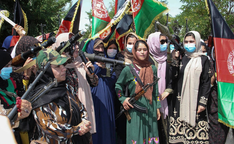 A group of Afghan aremed women protest in defiance of Taliban
