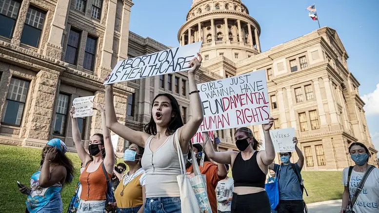 A group of women protesting the new attack on abortions